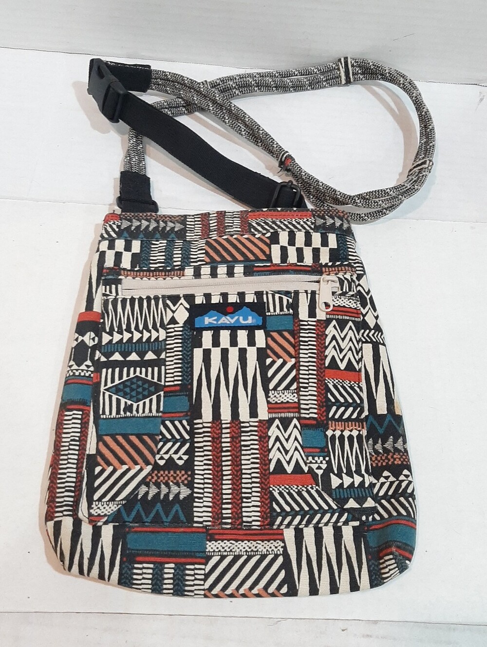 KAVU canvas crossbody bag with a geometric Aztec-style pattern adjustable strap